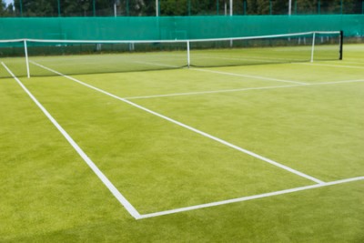 65717971-new-and-empty-lawn-tennis-court-and-net-outdoor-in-summer-or-spring.jpg